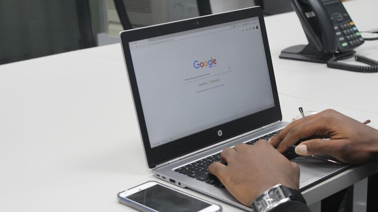 Man using Google on a laptop